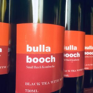 Several bottles of black tea kombucha by Bulla Booch